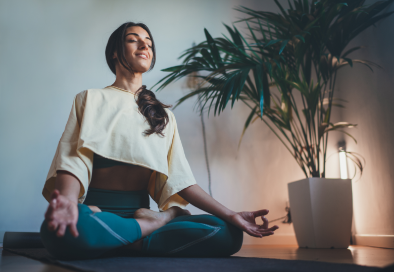 a girl meditating in a lotus position