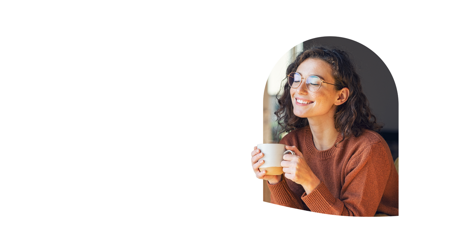 a girl smiling while holding a cup of tea
